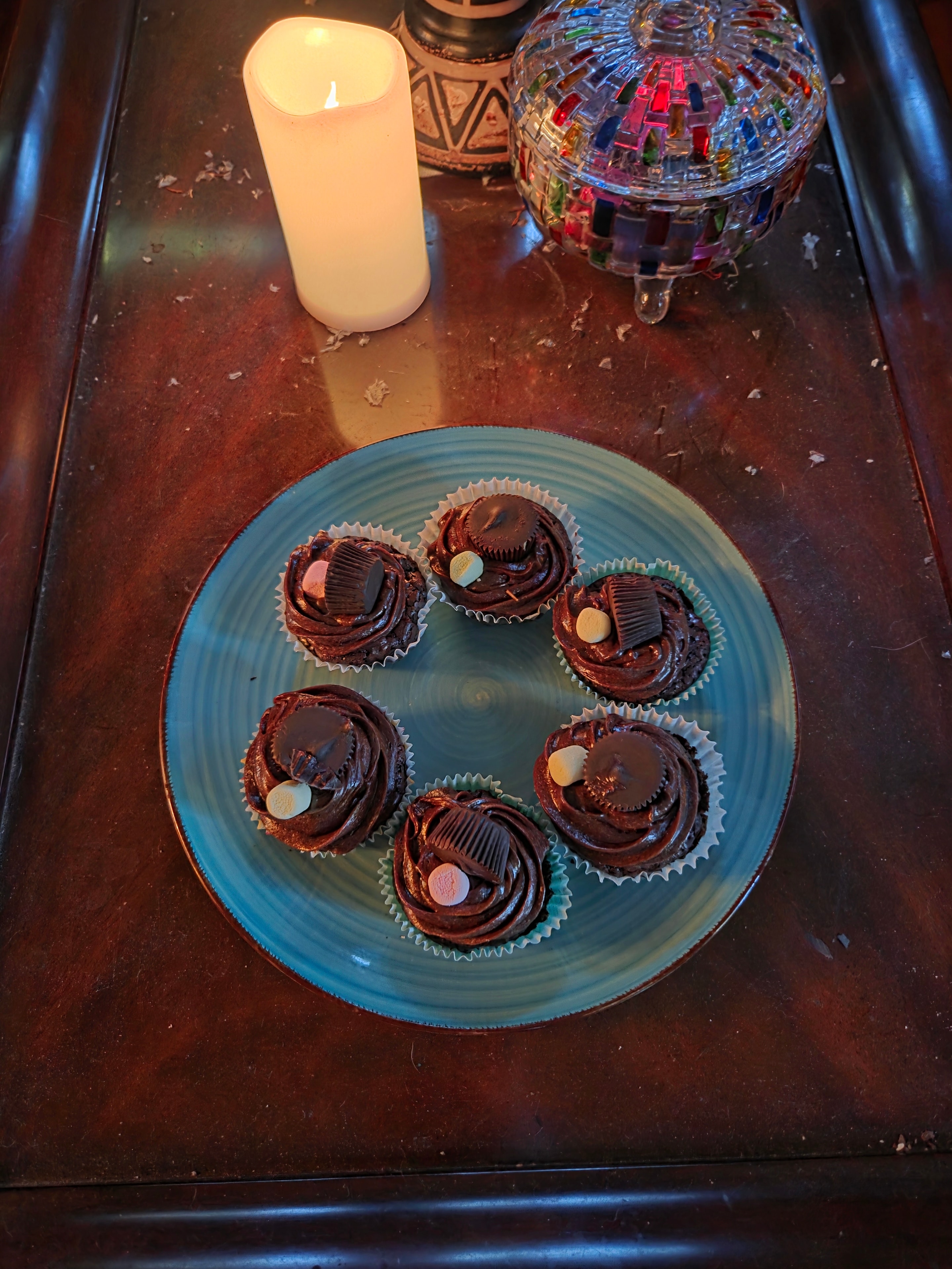 Christian's homemade chocolate cupcakes with Reese's peanut butter cups on a blue plate