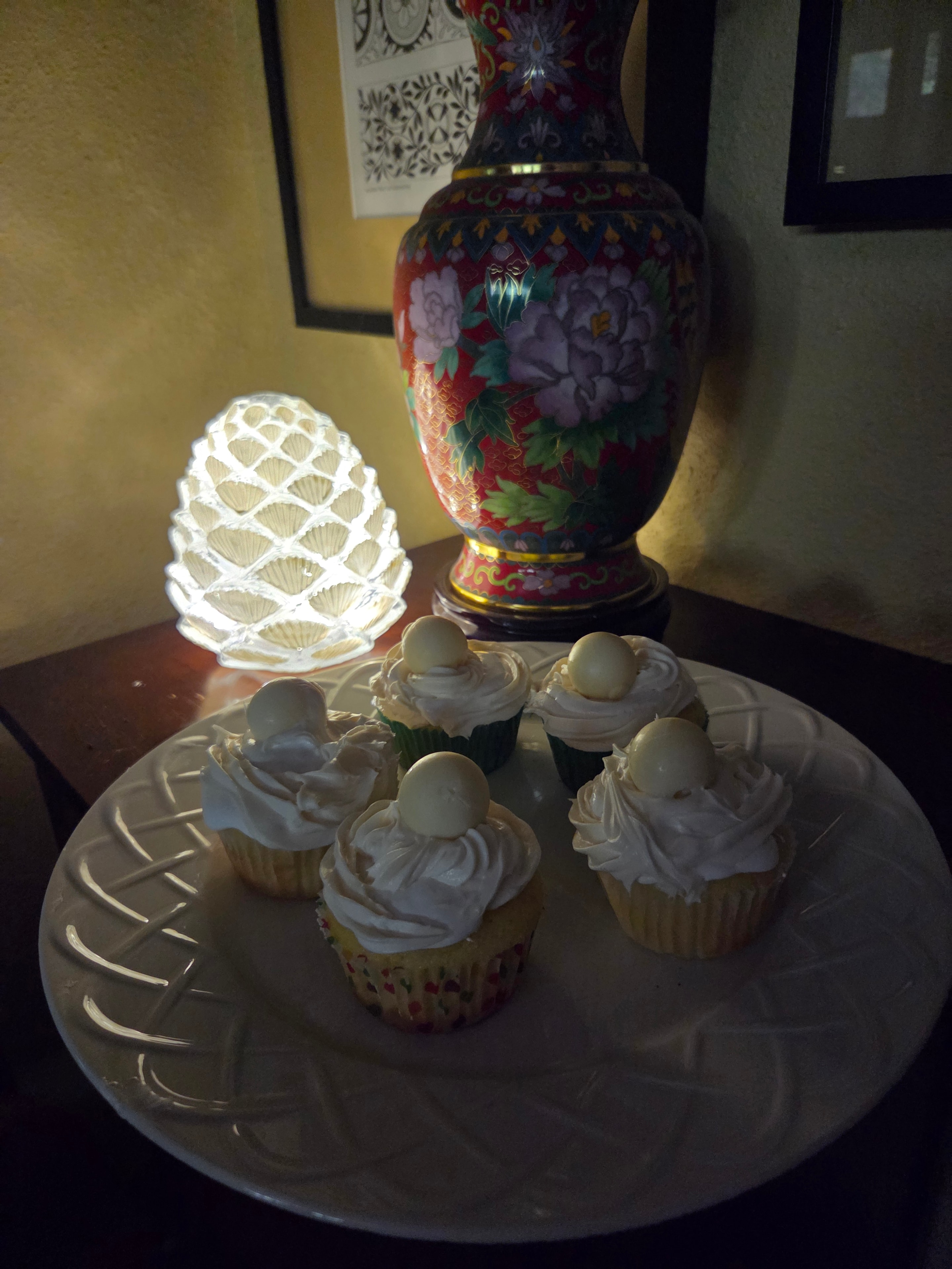 Christian's elegant vanilla cupcakes with white frosting on a decorative platter